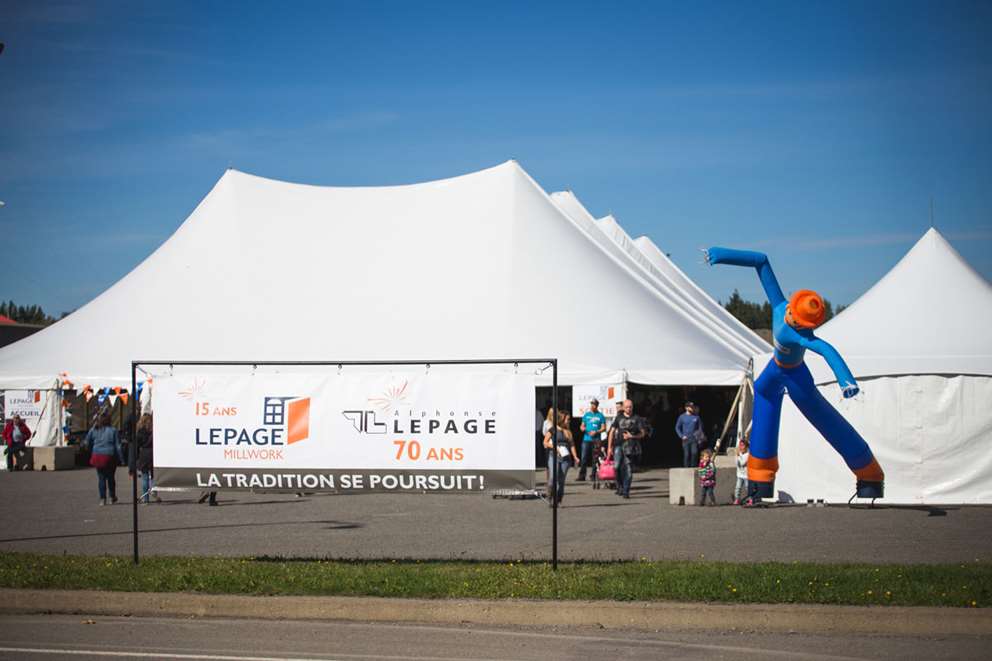 White tents with mascot